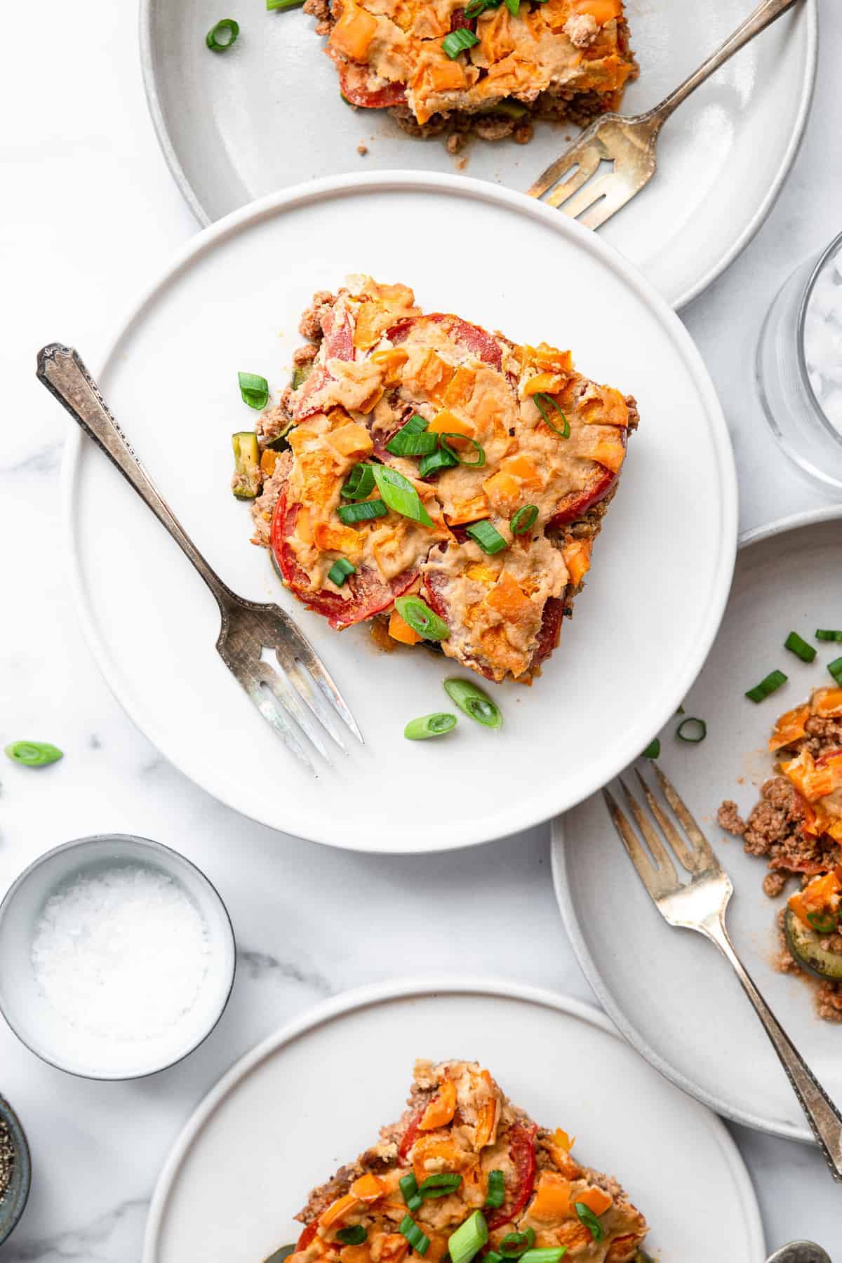 Dairy Free Paleo Casserole - This easy, gluten free and low carb chicken casserole is made of layers of fresh veggies, bright herbs and chicken! Naturally gluten free, whole30 and so delicious! | #Foodfaithfitness | #Glutenfree #Healthy #Whole30 #Lowcarb #Keto