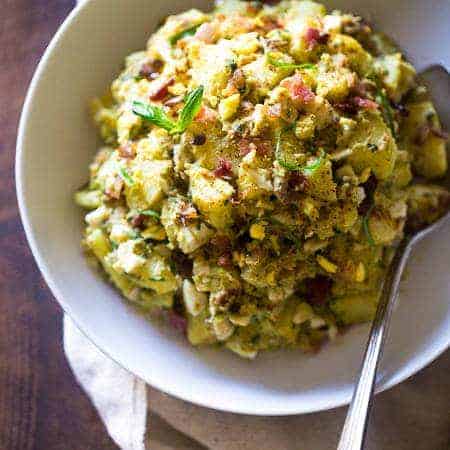 Paleo Sweet Potato Salad with Bacon, Eggs and Avocado Pesto – A healthy side dish that is SUPER creamy, easy to make and always a crowd pleaser! You won’t even miss the mayonnaise! | Foodfaithfitness.com | @FoodFaithFit