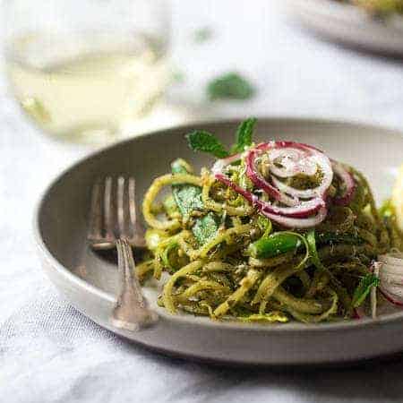 Turnip Noodle Pesto Pasta Salad with Peas and Asparagus – Spiralized turnips, asparagus and peas are tossed with pesto for a light, healthy and easy Spring meal! Low carb, gluten free and Vegetarian! | Foodfaithfitness.com | @FoodFaithFit