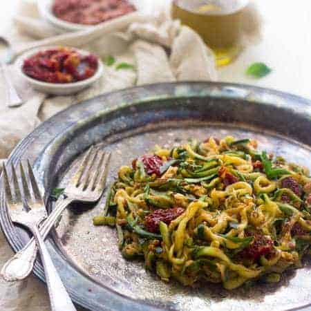 Raw Sundried Tomato Sauce with Zucchini Noodles - An easy meal that is big on flavor, but not on calories! | Foodfaithfitness.com | #raw #vegan #recipe #zucchinoodles