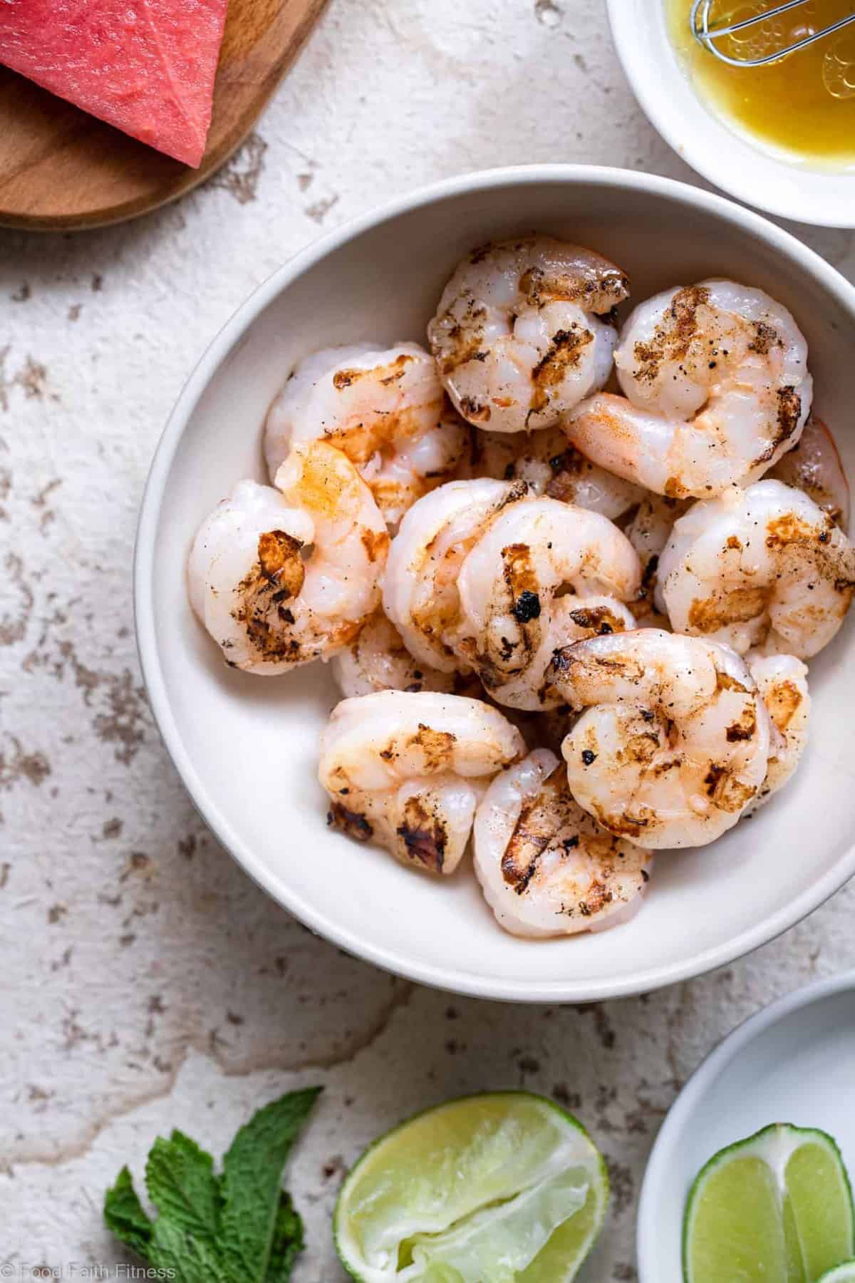 Shrimp Avocado Salad with Watermelon - An easy, healthy Summer dinner that is light and refreshing! Naturally gluten free, protein packed, under 300 calories and SO tasty! | #Foodfaithfitness | #Glutenfree #healthy #grainfree #watermelonĀ Grilled shrimp in a bowl