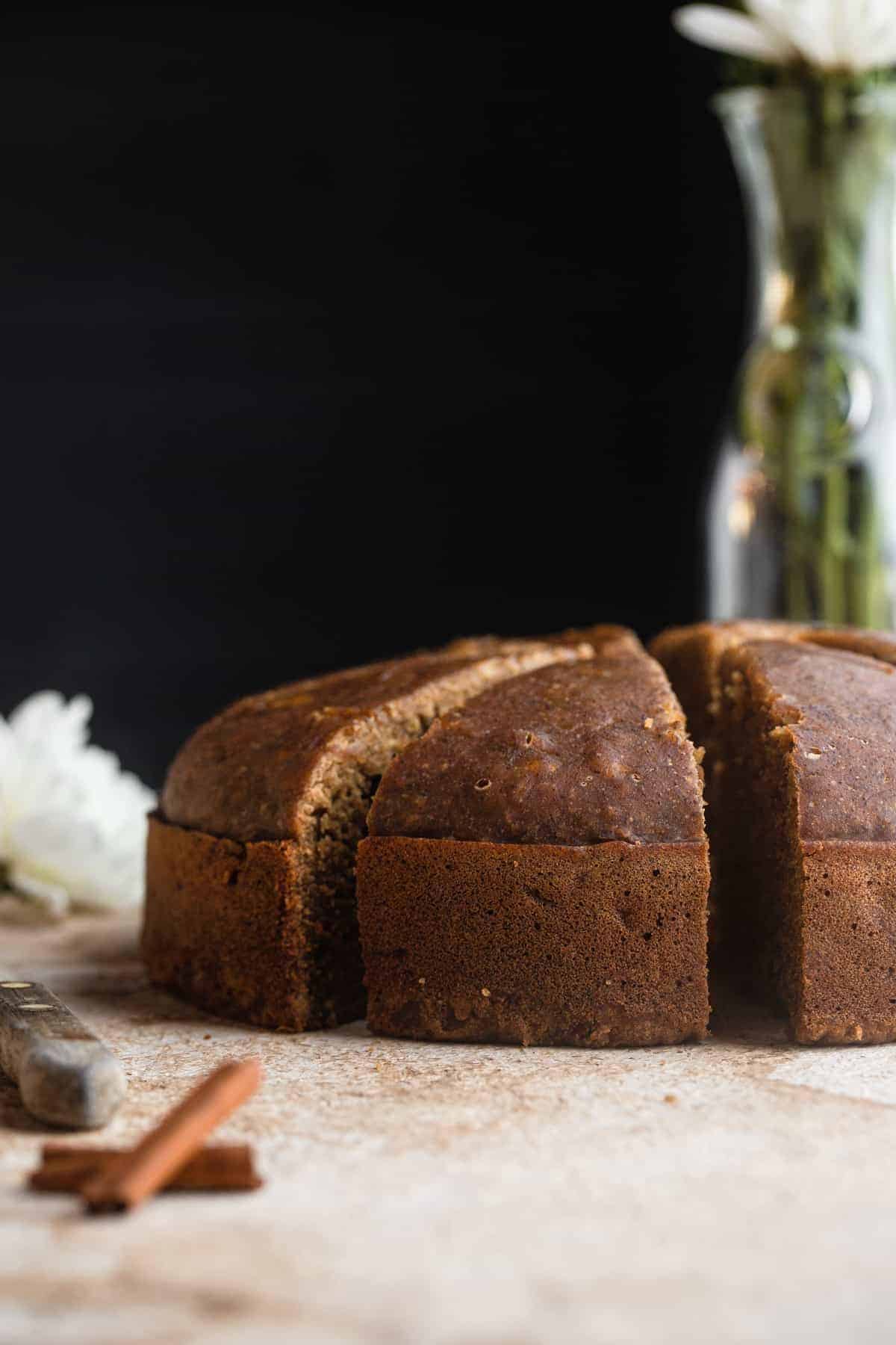 Instant Pot Banana Bread on a table with flowers