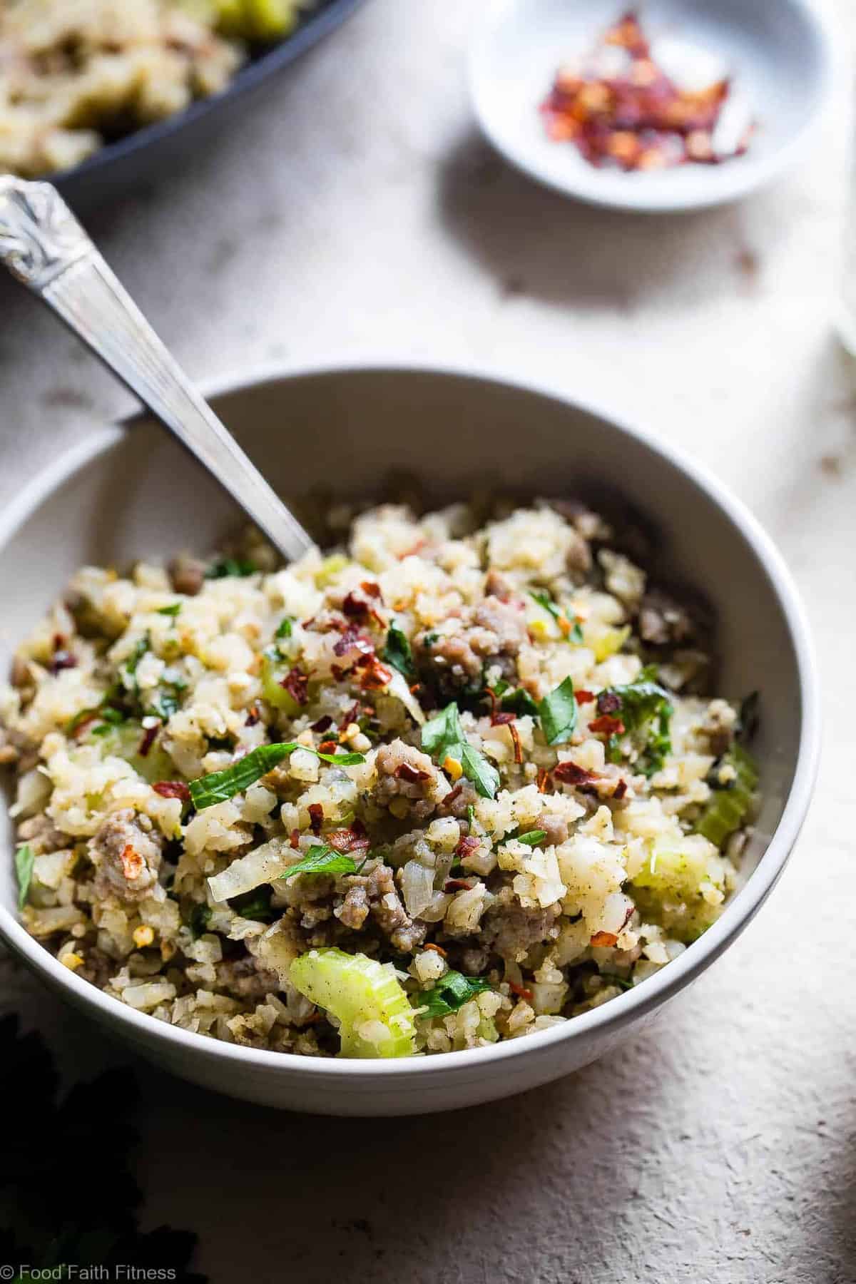 Keto Low Carb Riced Cauliflower Stuffing - This cauliflower rice stuffing is an EASY healthy holiday side that tastes like comfort food, but you won't miss the carbs! Paleo/whole30, only 150 calories and 3 SmartPoints! | #Foodfaithfitness | #Glutenfree #Paleo #Lowcarb #Keto #Whole30 Keto Low Carb Riced Cauliflower Stuffing - This cauliflower rice stuffing is an EASY healthy holiday side that tastes like comfort food, but you won't miss the carbs! Paleo/whole30, only 150 calories and 3 SmartPoints! | #Foodfaithfitness | #Glutenfree #Paleo #Lowcarb #Keto #Whole30