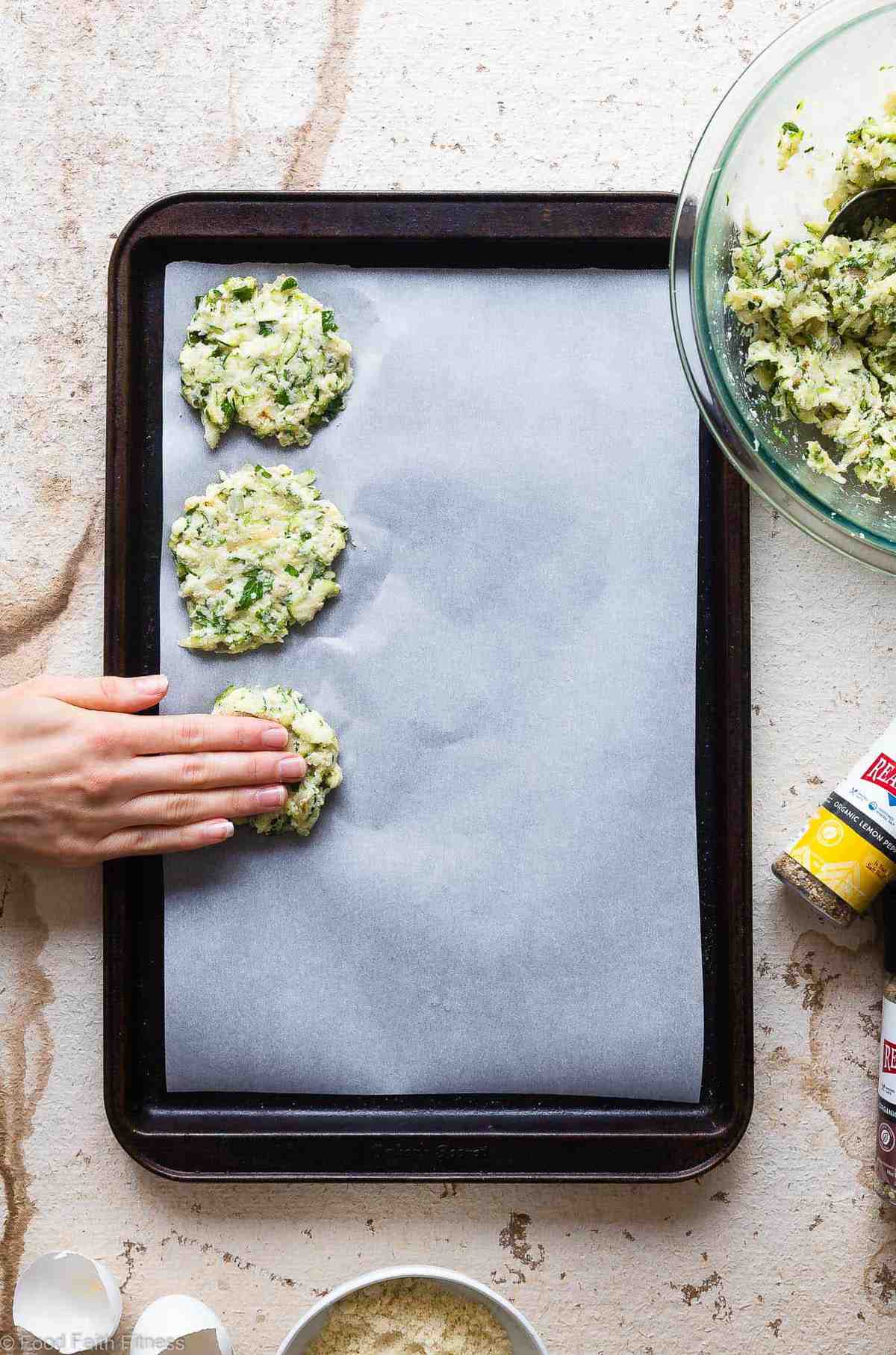 Paleo Baked Zucchini Fritters - These EAS, keto Baked Zucchini Fritters are served with an addicting lemon dill drop and are SO crispy, you'll never believe they're baked not fried! Gluten free, low carb, whole30 and insanely tasty! | #Foodfaithfitness | #Glutenfree #keto #Paleo #Whole30 #Lowcarb Paleo Baked Zucchini Fritters - These EAS, keto Baked Zucchini Fritters are served with an addicting lemon dill drop and are SO crispy, you'll never believe they're baked not fried! Gluten free, low carb, whole30 and insanely tasty! | #Foodfaithfitness | #Glutenfree #keto #Paleo #Whole30 #Lowcarb