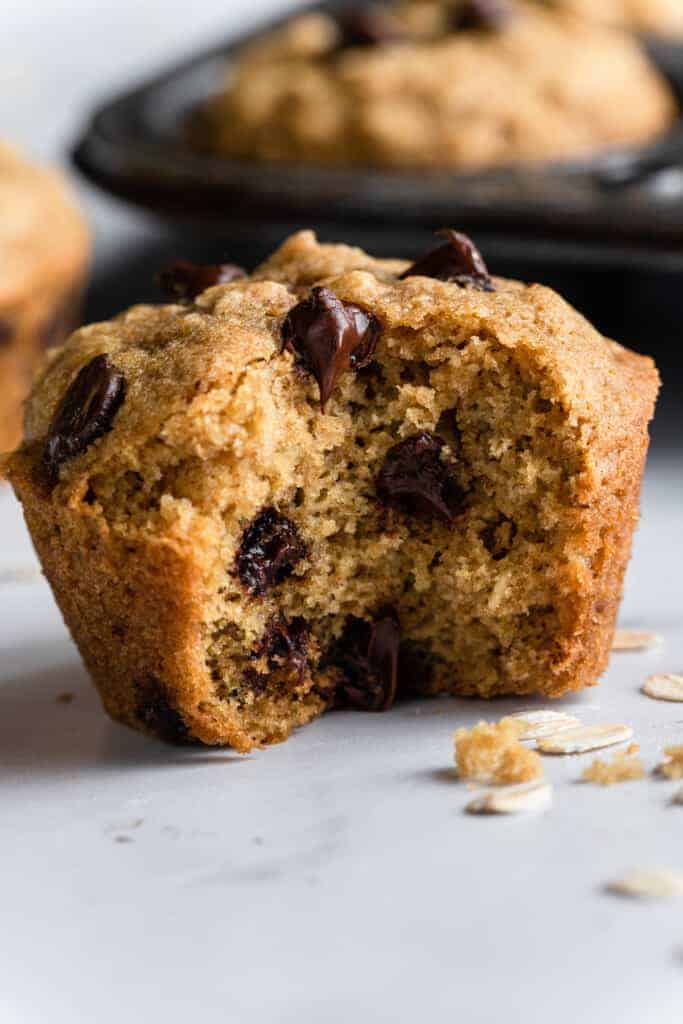 one Oatmeal Chocolate Chip Muffins with a bit missing
