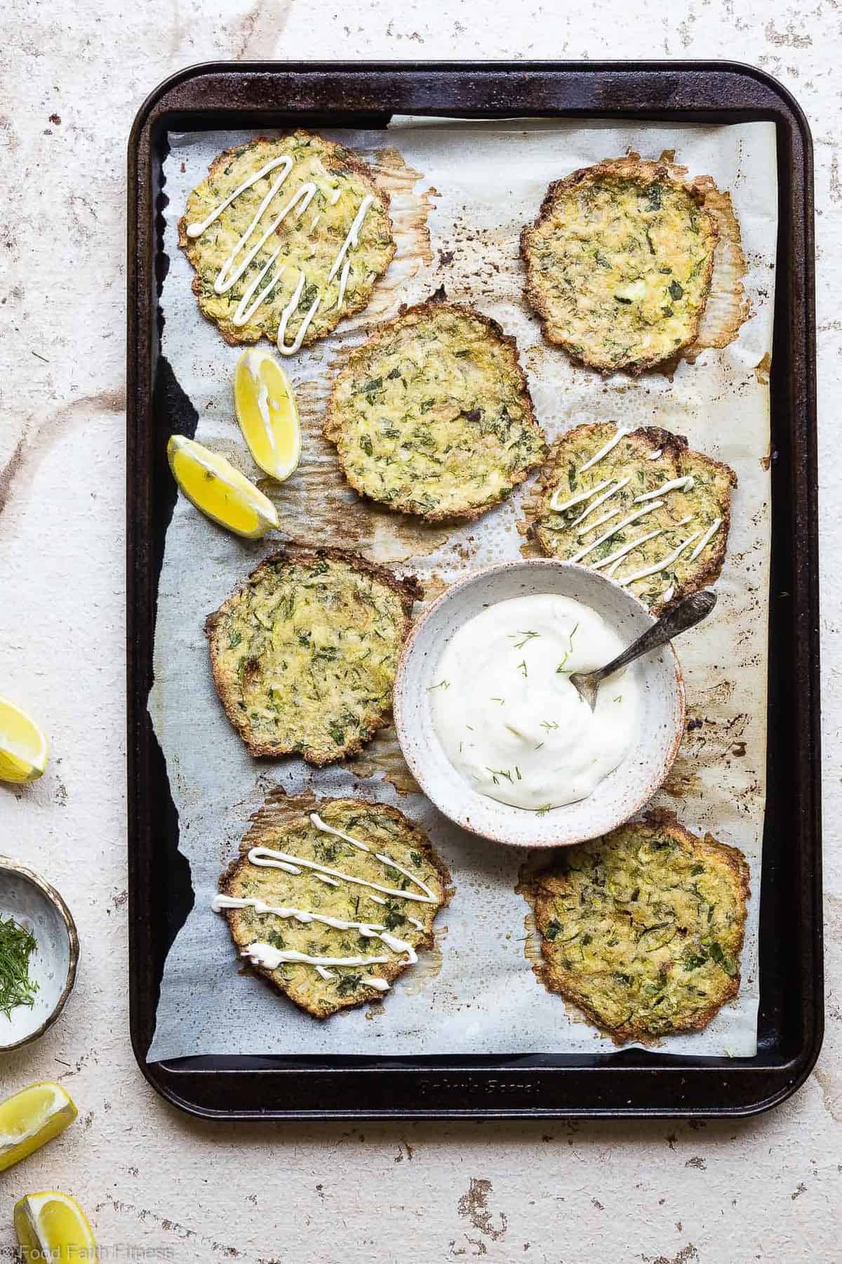 Paleo Baked Zucchini Fritters - These EAS, keto Baked Zucchini Fritters are served with an addicting lemon dill drop and are SO crispy, you'll never believe they're baked not fried! Gluten free, low carb, whole30 and insanely tasty! | #Foodfaithfitness | #Glutenfree #keto #Paleo #Whole30 #Lowcarb Paleo Baked Zucchini Fritters - These EAS, keto Baked Zucchini Fritters are served with an addicting lemon dill drop and are SO crispy, you'll never believe they're baked not fried! Gluten free, low carb, whole30 and insanely tasty! | #Foodfaithfitness | #Glutenfree #keto #Paleo #Whole30 #Lowcarb