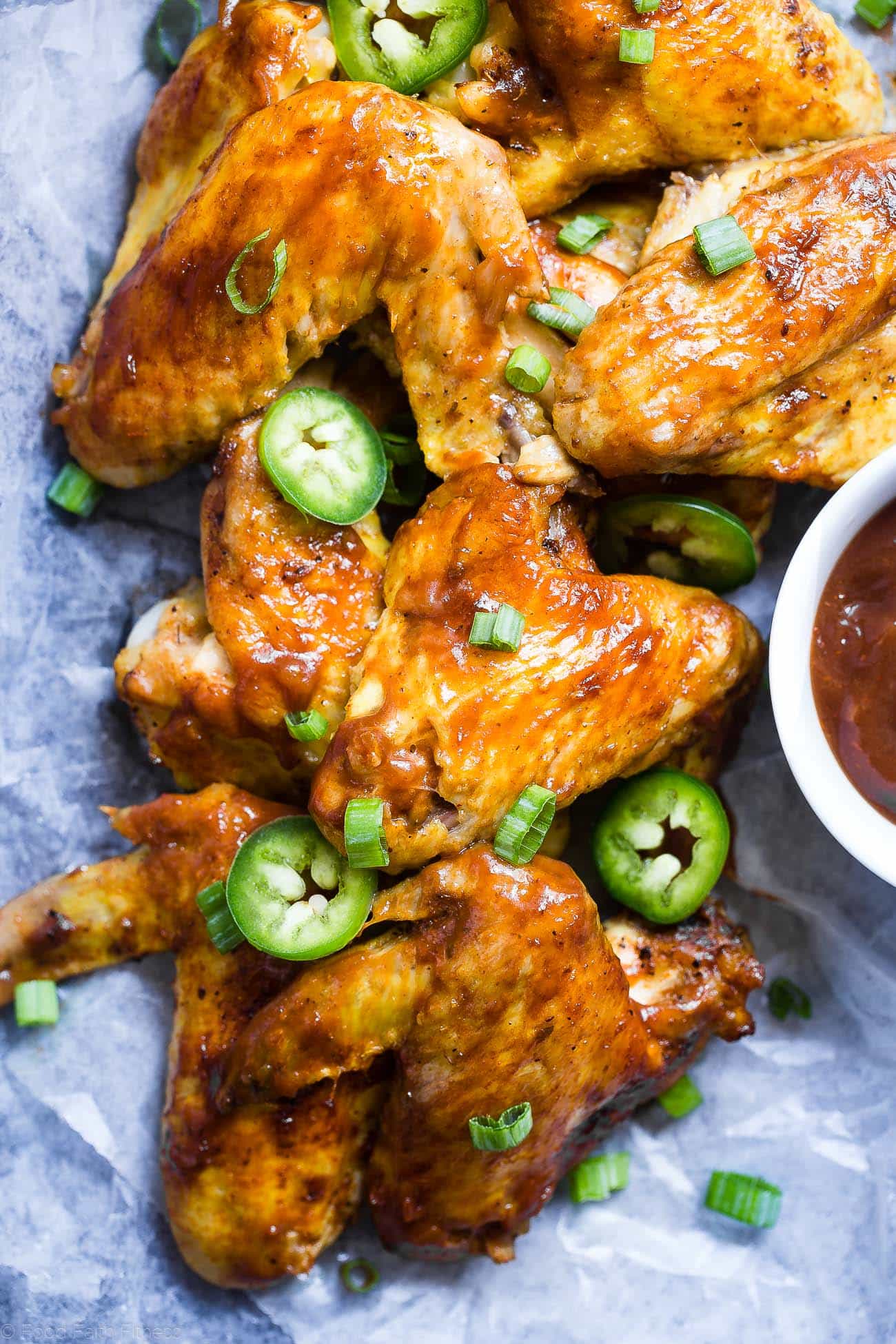 Slow Cooker BBQ Chicken Wings - Let the slow cooker do the work for you with these easy paleo-friendly chicken wings! A healthy, gluten, grain and dairy free, crowd pleasing appetizer for game day! | Foodfaithfitness.com | @FoodFaithFit