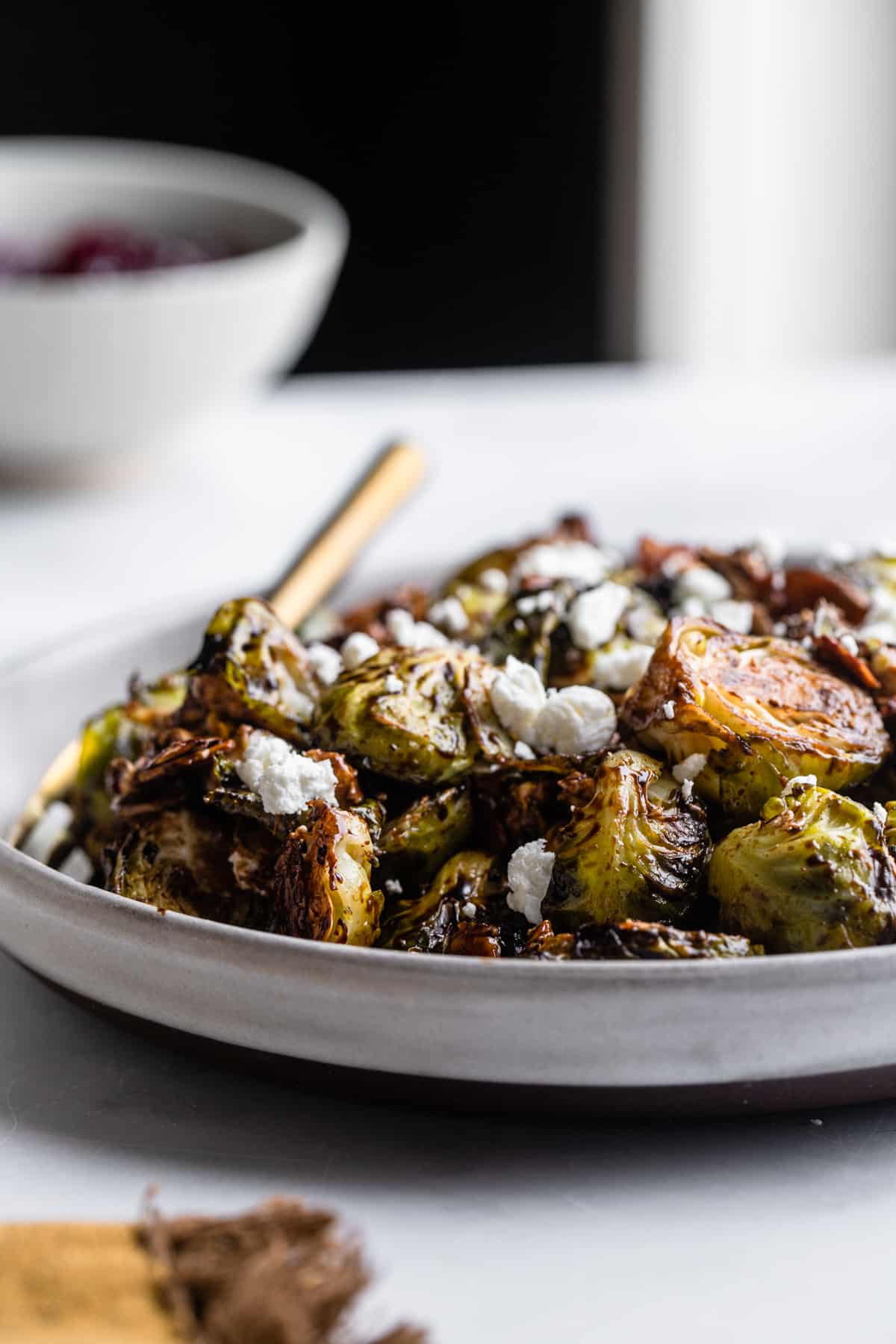 a plate of Roasted Balsamic Brussels on a table
