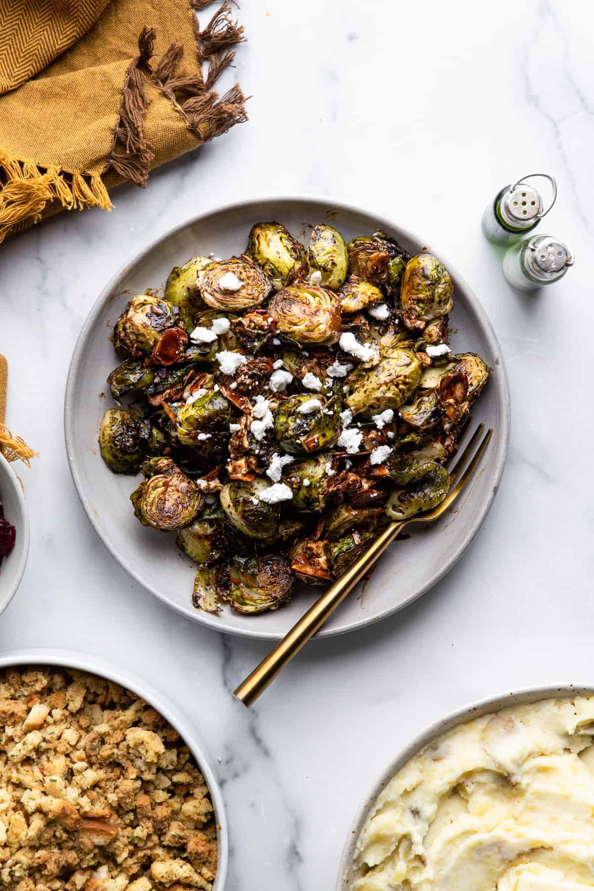 a large plate with Roasted Balsamic Brussels and a fork