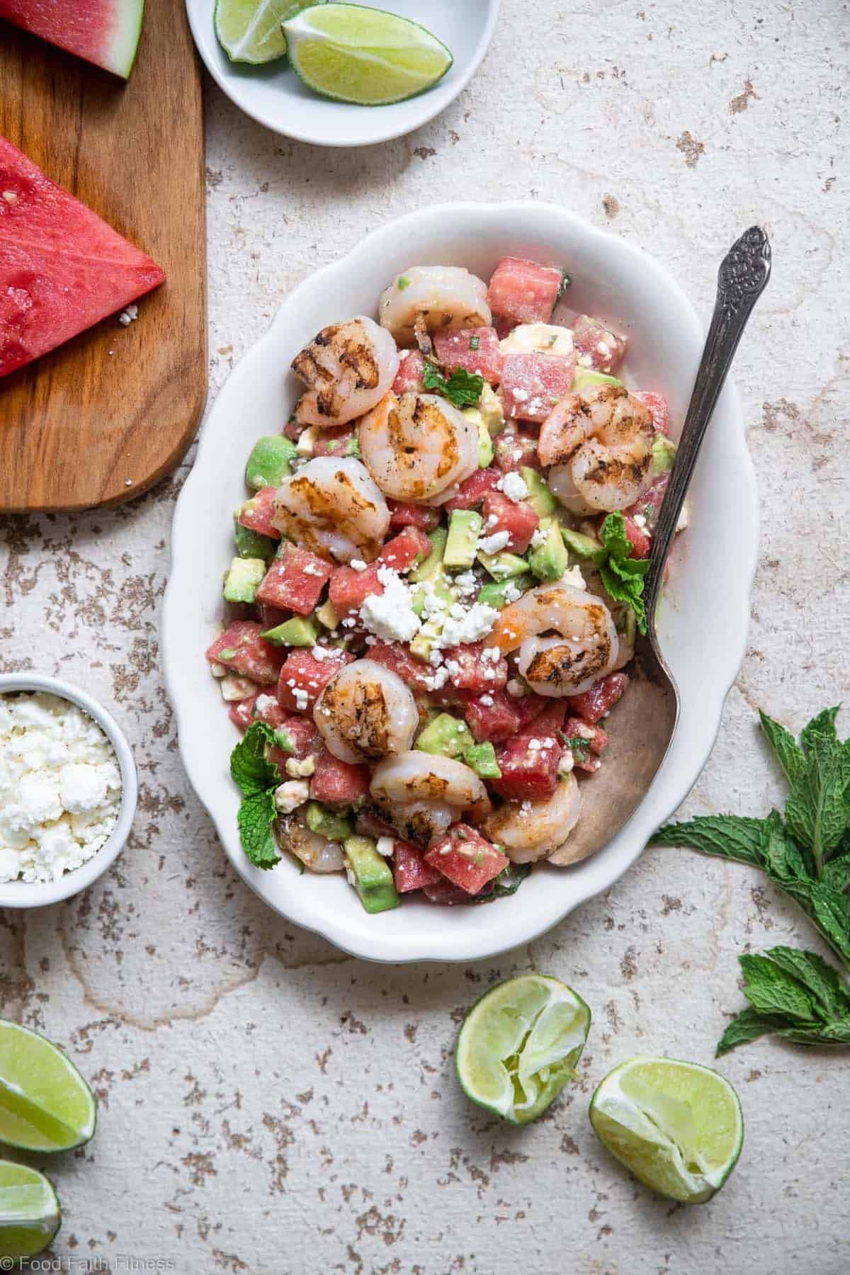 Shrimp Avocado Salad with Watermelon - An easy, healthy Summer dinner that is light and refreshing! Naturally gluten free, protein packed, under 300 calories and SO tasty! | #Foodfaithfitness | #Glutenfree #healthy #grainfree #watermelonĀ A plate filled with shrimp avocado salad with watermelon