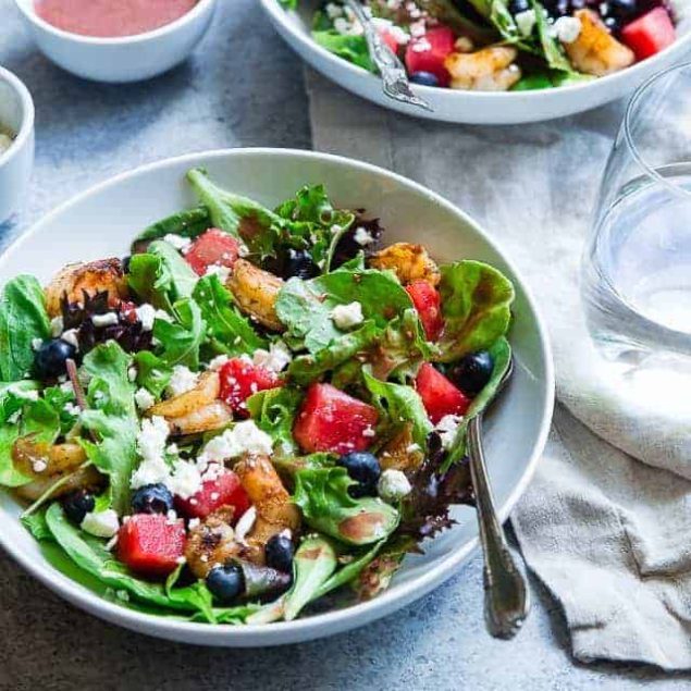 Watermelon Feta Salad with Cajun Shrimp - This easy Summer salad has spicy notes of Cajun shrimp and sweet berries! It's a crowd-pleasing, light and healthy, gluten free meal that is only 350 calories! | Foodfaithfitness.com | @FoodFaithFit