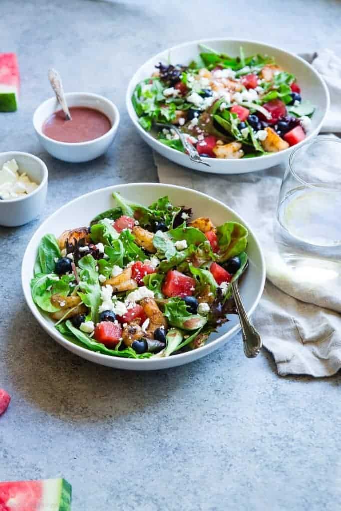 Watermelon Feta Salad with Cajun Shrimp in a bowl. Recipe on Foodfaithfitness.com