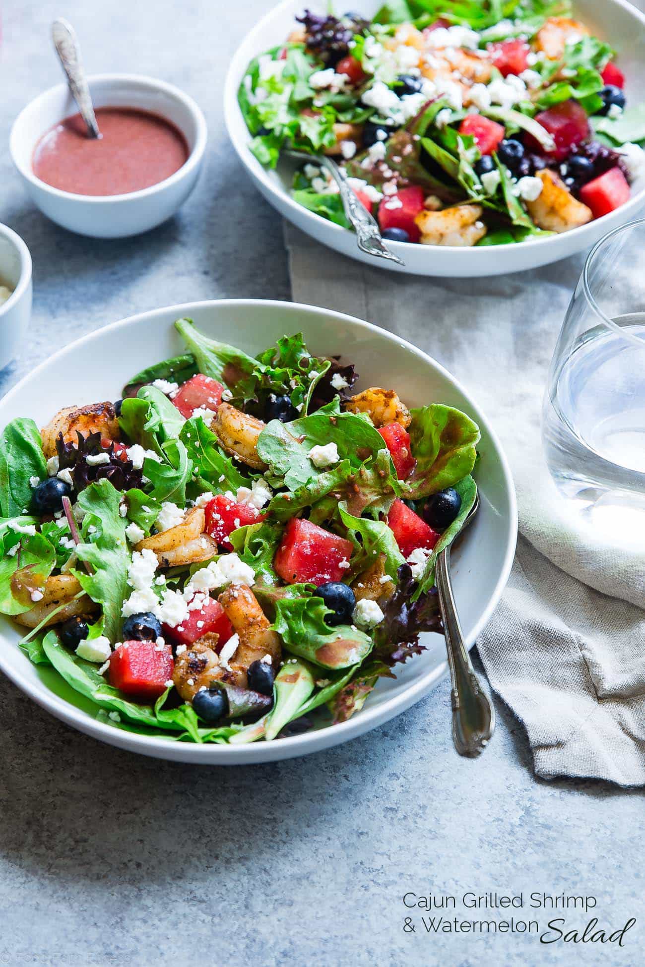 Close up photo of watermelon feta salad with cajun shrimp. Recipe on Foodfaithfitness.com
